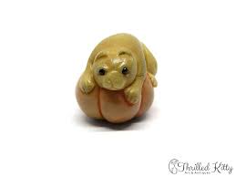 Japanese life and legend in miniature. Cat Tagua Nut Katabori Netsuke Thrilled Kitty