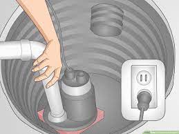 I couldn't see any way to get the cover off completely, since the hole in the cover is smaller in diameter than the elbow fitting. How To Clean Out A Sump Pit 10 Steps With Pictures Wikihow