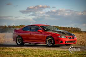 Image result for Bright Red 2004 Pontiac