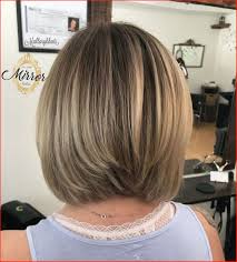 A side parted stacked hairstyle shows off long wavy tresses, while a center parted hairstyle frames the face symmetrically on both sides making for a balanced look. Stacked Inverted Bob Hairstyles Novocom Top