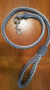One strand is centered and cow hitched around the buckle/pin, and the other two strands centered and put over the pin within the first strand's cow hitch. 3 5 Ft Dog Leash 8 Strand U202 Braid With An 8 Strand Double Edged Flat Braid Handle Abok 2996 A Double Diamond Knot At The Snap And A 14p 12b Regular Herringbone Knot For