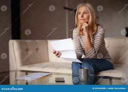 A Woman with a Bill in Her Hands. Bankruptcy and Financial Crisis Stock  Photo