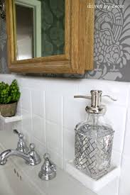 Rather than sticking with a basic vanity mirror, consider switching it up. Our Stenciled Bathroom Budget Makeover Reveal Driven By Decor