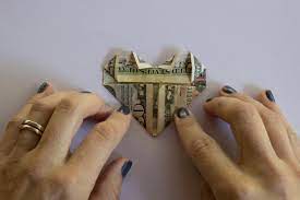 Fold tips sideways to the front to create top shape of heart. How To Fold A Dollar Bill Into An Origami Heart Hgtv