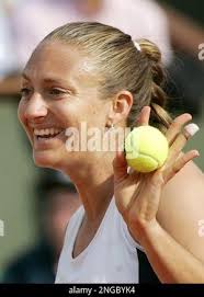France's Mary Pierce smiles as she plays top-seeded USA's Lindsay Davenport  during their quarterfinals match of the French Open tennis tournament at  the Roland Garros stadium, Tuesday May 31, 2005 in Paris. Pierce won 6-3,  6-2. ( AP Photo/Francois ...