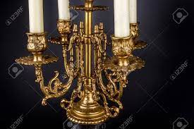 Visit efavormart to buy laser cut candle wraps and decorative foil wraps for flameless tea lights, led votive candles, votive holder and more! Antique Bronze Chandelier Candle Holder On A Black Background Stock Photo Picture And Royalty Free Image Image 53534846