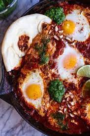 Indian Style Baked Eggs With Green Harissa And Naan Food Recipes Baked Eggs