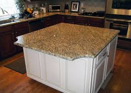 Backsplash ideas for kitchens with white cabinets. New Venetian Gold Granite