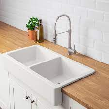 This kitchen featured on homepolish has a classic, white farmhouse sink made of fireclay. Havsen Apron Front Double Bowl Sink White Ikea