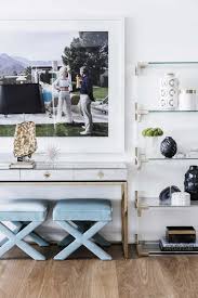 Gorgeous Shelf Styling With Large Artwork And X Benches Lucite And Brass Shelf Slim Aaron Artwork Kaufman Des Home Decor House And Home Magazine Interior