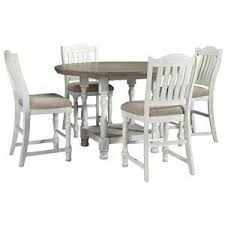One good way to do this is to measure the length and width of the room where your new table will go. Millennium Havalance 392381439 Round Dining Room Counter Height Table And 4 Upholstered Barstools Set Sam Levitz Furniture Dining 5 Piece Sets