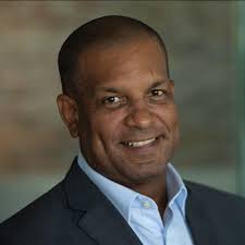 What is the location of the beautiful beach in the Cayman Islands?