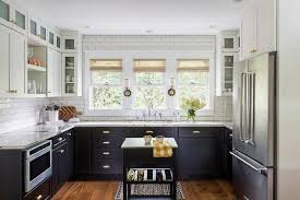 black lower cabinets with brass cup