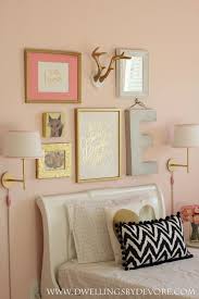 For the bookish type the overlapping square frames above the bed would seem to suit. Angelic Favorite Paint Colors Gold Girls Room Gallery Wall Bedroom Bedroom Ideas Pinterest