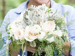 For this southern bride's something blue, she added a navy blue ribbon around her lavish bouquet of baby blue hydrangeas, soft pink roses and baby's breath. Wedding Flowers Bouquet Ideas Southern Living
