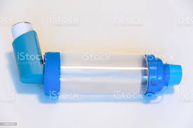 Asthma Reliever Inhaler With A Spacer Stock Photo - Download Image Now -  iStock