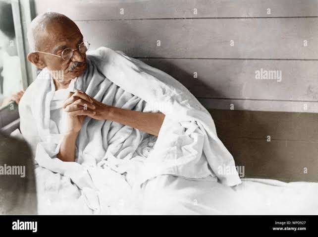 Mahatma Gandhi resting during train journey in Kathiyawad, India, Asia, July 1934 Stock Photo - Alamy