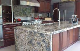 The wooden counter is attached to the white kitchen island to create a breakfast bar with gray counter chairs. Diamond Arrow Granite Contemporary Kitchen Miami By Marble Of The World Houzz