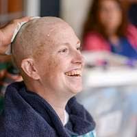 Sgt. 1st Class John Setera lathers Maj. Melissa Culbreth's