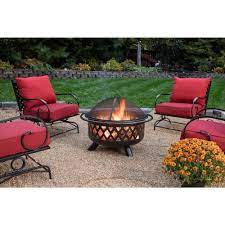 A wood grate is included to make your fires larger and more consistent as well as drain holes to keep your pit free of rainwater. Endless Summer 30 In D Bronze Finish Portable Lattice Wood Burning Fire Pit Wad792sp The Home Depot Outdoor Fire Pit Area Wood Burning Fire Pit Outdoor Fire Pit