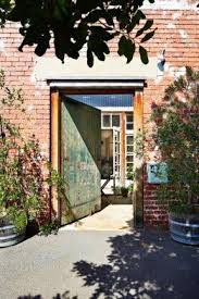 Nina Proudman S Offspring Apartment Front Door Entry Barn Door Converted Warehouse Melbourne House Warehouse Home