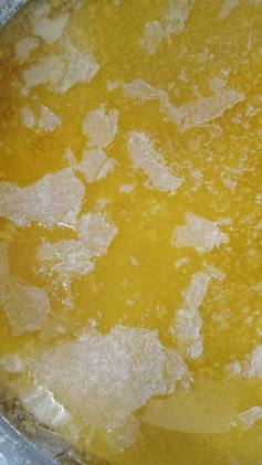 The natural granular texture characteristic of slow-cooked Bilona ghee, AI generated