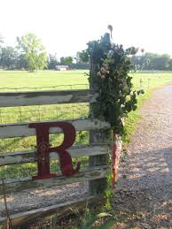 You can create this too rustic paths and tree stumps keep this area looking natural, too. Barn Wedding Farm Entrance Ranch Entrance Farm Gate