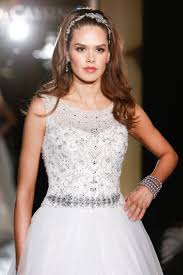 For a unique beach wedding hairstyle, braid one side back and add a floral hair vine into the other side for a creative, asymmetrical hairdo. Bridal Hair Ideas Chic Wedding Hairstyles For Thin Hair