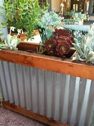 I've designed and built a diy planter container with corrugated steel to grow my vegetables. Pin By Jewel Nunez On The Great Outdoors Tin Planters Iron Planters Planter Boxes