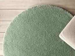 A Beige Adum Rug In Front Of A White Sofa Ikea Rug Classroom Rugs Cheap Circular Rugs