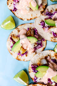 To make them, heat up some corn tortillas and pile everything on top. Fish Tacos With Limey Slaw Bang Bang Sauce