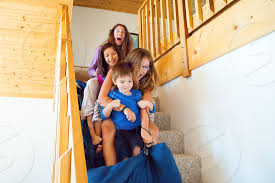 Maybe you would like to learn more about one of these? Four Siblings Ride A Sleeping Bag Down A Carpeted Staircase In A Cabin They Are Wide Eyed With Excitement By Jeanette Brown Photo Stock Snapwire
