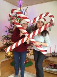 Place the rest of the candy canes on a table, then set a timer and see who can hook the most canes in the. 50 Best Candy Cane Christmas Decorations Which Are The Sweetest Things You Ve Ever Seen Hike N Dip Candy Christmas Decorations Christmas Props Candy Cane Decorations