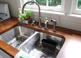 It's very important to install an undermount kitchen sink before the countertop slabs are set down. This That Countertops Undermount Kitchen Sinks Best Kitchen Sinks Ikea Butcher Block Countertops