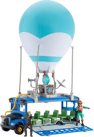 Inside of battle bus is a storage case. Amazon Com Fortnite Battle Bus Deluxe Features Inflatable Balloon With Lights Sounds Free Rolling Wheels On Bus Includes 4 Inch Recruit Jonesy And Exclusive Tomatohead Action Figures Toys Games