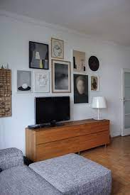 bilderwand mit optisch integriertem fernseher wohnzimmer dekoration ideen wohnzimmer design wohnzimer