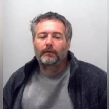 Wanted man with devil tattoo