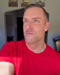 Select the correct answer to complete the sentence from the options below.  Looking out the window, I am thinking about... 1) how I hope it doesn't  rain because I just washed my