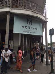 Workers standing in the shadow of suspension bridge. Monty S On The Square Picture Of Monty S On The Square New Orleans Tripadvisor