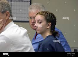 Toni Fratto looks at Elko District Attorney Mark Torvinen during a  preliminary hearing Wednesday July 13, 2011 in Elko, Nev.. Fratto is one of  two accused of murdering Micaela Costanzo in March