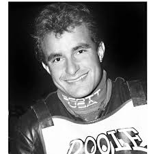 Technical question: why is the rider lifting the front of the bike and what  is he looking for? Who was