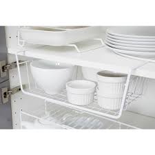 A great way to display your cookware is to add a storage shelf with a rail to your kitchen wall. Wilko Hanging Storage Shelf Wilko