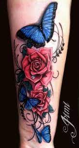 Blue butterfly and rose bud tattoo on leg. Rose Tattoos For Women Blue Rose Tattoos Butterfly Tattoos For Women