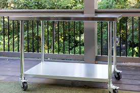 It consists of rectangular table with 4 chairs. How To Transform A Stainless Steel Cart Into An Outdoor Kitchen Island Hgtv