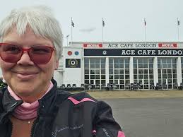Dave Day And some more bikers with the cars as they come up the hill & into  Barrow
