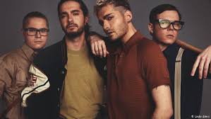 The later of the two photos shows him standing before a microphone under what appears to be a bridal arch. Tokio Hotel Gets Political In A Talk About Their New Album Music Dw 02 03 2017