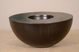 A Patinated Steel Vessel Of Hemisphere Form Burden