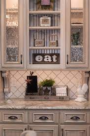 Consider mingling other colors in this ser Backsplash Tile Antique White Arabesque Beige Grout Chamois Antique White Kitchen Kitchen Remodel Beige Kitchen Cabinets