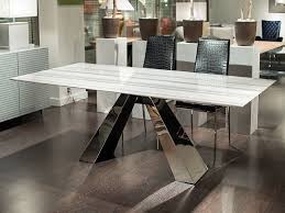 Expand your round dining table with a convenient butterfly leaf, and then put it away when done. Stone International Butterfly Slim Edge Rectangular Marble Dining Table