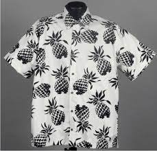 This pineapple print tee has a design with a black and white pineapple, with a yellow stripe across the pineapple. Pineapple Hawaiian Shirt
